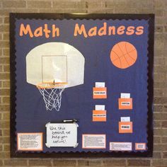 a bulletin board with basketballs on it and instructions for math madness written on the back