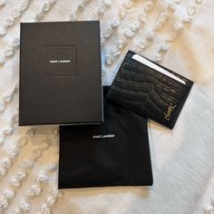 New With Tag, Dust Bag & Box Saint Laurent Cardholder Black Embossed Leather With Gold Logo Designer Card Holder With Original Box For Gift, Designer Crocodile Pattern Wallet, Designer Crocodile Pattern Rectangular Wallet, Designer Evening Card Holder With Interior Slots, Luxury Crocodile Pattern Card Holder, Elegant Crocodile Pattern Card Holder, Elegant Rectangular Crocodile Pattern Card Holder, Designer Rectangular Card Holder For Evening, Elegant Formal Card Holder With Original Box