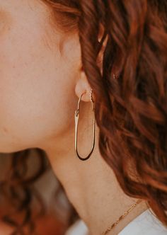 These hoops have just the right amount of movement thanks to the perfect amount of hammered texture and the swing latch design. Measures 2" long by 1" wide. Hoop hinge is made of 18g wire. Sold as a pair. Available in 14kt Gold Fill + Sterling Silver. Paired with our best-selling earring, the Tiny Twist Earrings. Handmade in Eau Claire, WI. Our jewelry is handmade so each piece will be unique and may vary slightly from what is pictured. Hand Forged 14k Gold Filled Hoop Earrings, Modern 14k Gold Hammered Hoop Earrings, Copper Uses, Everyday Wear Jewelry, Adornment Jewelry, Jewelry Cleaner, Jewelry Case, 14kt Gold, Earring Necklace