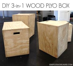 three wooden plyo boxes sitting on top of a black floor next to each other