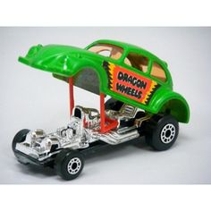 a green toy car with flames on it