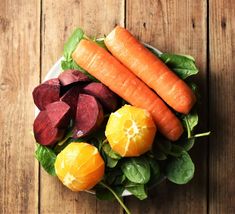 carrots, beets and spinach on a plate