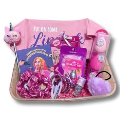 a pink gift basket filled with lots of beauty products and personal care items for women