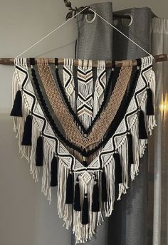 a curtain with tassels hanging from it