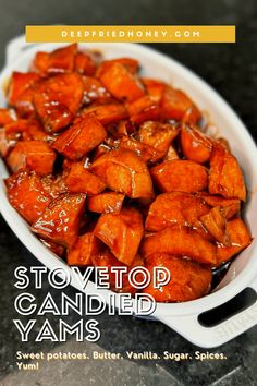 a white bowl filled with sweet potatoes covered in caramel sauce on top of a counter