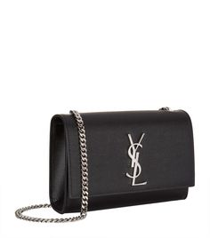 Lifted with the now iconic YSL logo lettering to the front dating back to the 1960s, the Kate shoulder bag from Saint Laurent is as timeless as it is glamorous. Exquisitely crafted from grained leather, open the flap front to reveal an interior perfectly sized for your mobile phone and lipstick. Have it swing from the silver-tone chain shoulder strap or tuck it inside and carry as a clutch. Phone Card Holder, Luxury Stationery, Changing Bag, Phone Card, Watch Gifts, Small Crossbody Bag, Small Crossbody