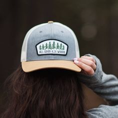 The smell of pine hanging in the air. The cushion of fallen needles underfoot. Camp is set up and the fire is burning. Sit back, relax, and contemplate the day’s adventures and those to come. It’s all good in the woods. Mid-profile, structured, snapback, curved bill, one size fits most Product Photo Ideas, Camping Hat, Outdoor Clothes, Highland Cows, Hiking Adventure, Fall 23, Camping Outfits, Ball Caps, Hats For Sale