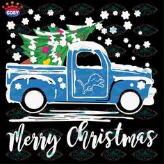 an old blue truck with a christmas tree on the back is shown in front of snowflakes