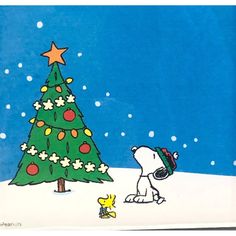 a charlie brown christmas card with a dog and a tree