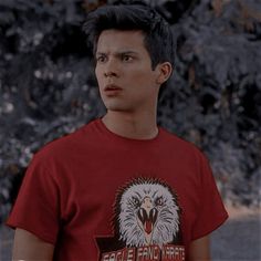 a man in a red shirt with an eagle on it's t - shirt