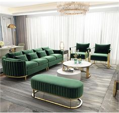 a living room filled with green couches and chairs next to a white coffee table