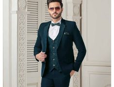 This is a Classic  Suit by Golden Attire crafted from high quality fabric and imported materials. Our products are handcrafted by experienced tailors who make sure the that the stitching is precise, lining is proper and the overall product is sturdy enough to not go out of shape for more than a few years. Also all our products have extra margins in their length, sleeves, sides so it's easily alterable if your size changes after some time. To see more available colours and designs in this collect Classic Fitted Festive Sets, Traditional Tailored Suit For Semi-formal Occasions, Traditional Green Unstitched Suit For Formal Occasions, Green Traditional Unstitched Suit For Formal Occasions, Green Tuxedo With Suit Collar For Wedding, Festive Green Semi-formal Bandhgala, Green Tuxedo Suit For Wedding, Green Tuxedo Style Three-piece Suit For Wedding, Classic Fitted Lawn Suit For Formal Occasions