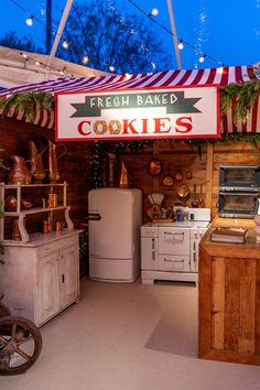 an outdoor kitchen that is decorated for christmas