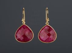 This pair of large ruby earrings would be a nice reward for yourself or a great gift for your mother or best friend. The pendant has an attractive ruby stone set in gold plated bezels: 1. Stone: ruby 2. Stone shape & size: pear shape 25 x 20 mm ; heart 20 x 20 mm 3. total length: pear 42 mm; heart 36 mm 4. bezel material: gold vermeil or sterling silver 5. earring hook: gold vermeil or sterling silver 6. an optional custom jewelry card printed with your own message, if you are sending these Pear-shaped Ruby Gemstone Earrings, Pear-shaped Ruby Earrings, Ruby Teardrop Earrings Fine Jewelry, Ruby Fine Jewelry Earrings For Party, Fine Ruby Earrings For Parties, Red Ruby Drop Earrings, Ruby Teardrop Earrings For Formal Occasions, Handmade Ruby Teardrop Earrings, Red Ruby Pear-shaped Earrings