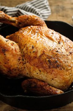 a roasted chicken in a cast iron skillet