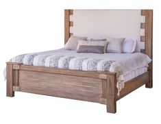 a wooden bed with white sheets and pillows on it's headboard is shown