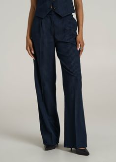 Elevate Every Occasion High-Rise Wide-Leg Pleated Dress Pants for Tall Women Add a hint of elegance with these High-Rise Wide-Leg Pleated Dress Pants, a must-have wardrobe staple for tall ladies. These women's tall pants marry the grace of a wide leg with the sophistication of pleats, ensuring you stand with style and confidence at any event. With a high rise that cinches your waist and a fluid drape that elongates your legs, these tall women's pants are a celebration of fashion and form.• Pleat Striped Wide-leg Pants For Business Casual, Striped Wide Leg Formal Bottoms, Classic Striped Wide-leg Pants, Chic Blue Vertical Striped Pants, Chic Blue Pants With Vertical Stripes, Striped Wide Leg Formal Pants, Tailored Striped Wide-leg Dress Pants, Elegant Striped Straight Leg Pants, Striped Wide Leg Pants For Formal Occasions