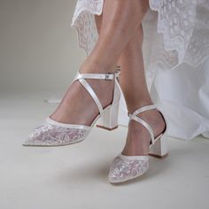 a close up of a person wearing white shoes