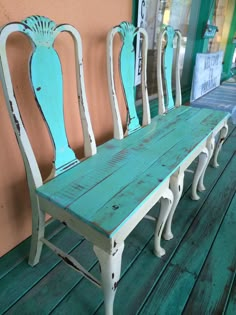 four chairs sitting on top of a wooden floor