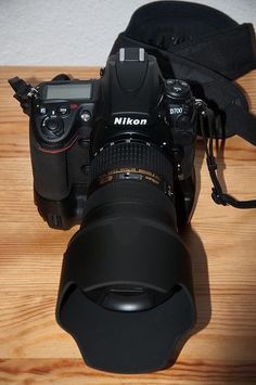 a camera sitting on top of a wooden table