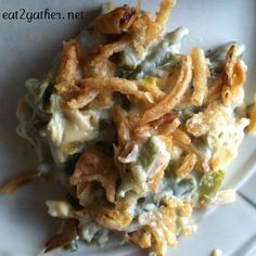 a white plate topped with cheesy green bean casserole