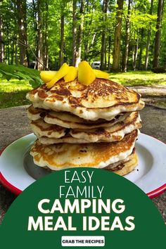 a stack of pancakes sitting on top of a white plate next to a green sign that says easy family camping meal ideas