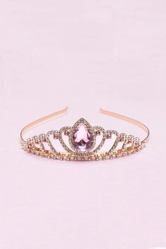 Introducing our exquisite Regal Pink Tiara, a stunning accessory fit for royalty. Crafted with precision and adorned with captivating details, this tiara embodies elegance, grace, and sophistication. It is the perfect crowning jewel for those seeking a touch of regal charm. The Boutique Regal Tiara boasts a mesmerizing design that effortlessly captures attention. The delicately crafted rose gold base provides a solid foundation, ensuring durability and a comfortable fit. Encrusted with shimmerin Pink Tiara, Rhinestone Tiara, Rhinestone Crown, Headband Tiara, Small Boutique, Rhinestone Headband, Crown Headband, The Boutique, Tiaras And Crowns