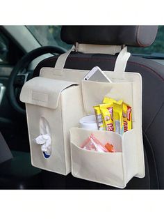 the back seat pocket is filled with snacks and other things to keep in the car