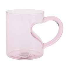 a pink coffee mug with a heart shaped handle