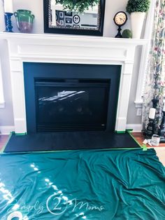 a living room with a fireplace covered in a green tarp next to a mirror