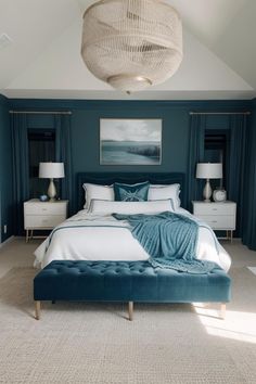 a bedroom with blue walls and white bedding