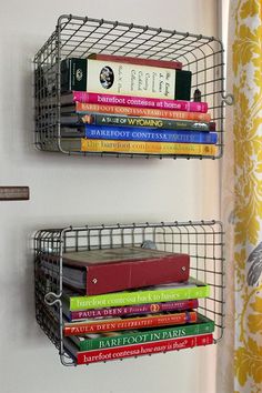 two metal shelves with books on them