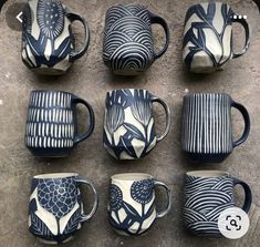 nine coffee mugs with designs on them sitting next to each other in different shapes and sizes