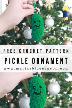 a crocheted pickle ornament hanging from a christmas tree with the words free crochet pattern