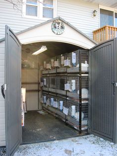 an open garage door with lots of items in the storage area and on the outside