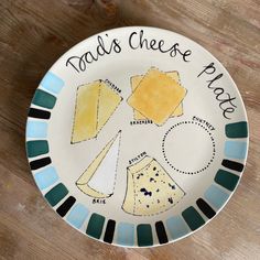 a plate that has some different types of cheese on it with the words tad's cheese place