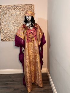 African/Nigeria bubu brocade outfit. One size. Oversized,And  Please note measurements: Width: 64inches Lenght: 62inches Festive Gold Thobe For Festivals, Bohemian Ceremonial Kaftan With Dabka, Bohemian Dabka Kaftan For Ceremonial Occasions, Bohemian Ceremonial Kaftan With Dabka Detailing, Festive Long Silk Kaftan, Bohemian Gold Kaftan For Festive Occasions, Festive Free Size Kaftan For Eid, Gold Abaya For Festivals, Festive Free-size Kaftan For Eid