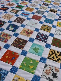 a quilted table top with many different designs on it