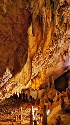 the inside of a cave with many formations