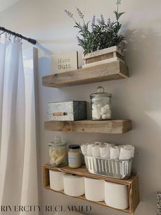 some shelves are holding toiletries and other items in the bathroom, while another shelf is above them