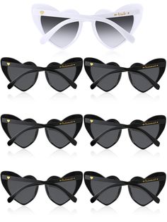 six pairs of black and white sunglasses with cat's eye shaped frames, all in different