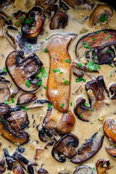 a pan filled with mushrooms covered in gravy