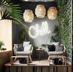 two wicker chairs sitting on top of a wooden table in front of a neon sign