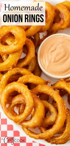 onion rings on a plate with dipping sauce in the middle and text overlay that reads homemade onion rings