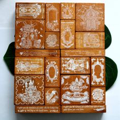 several wooden blocks with white designs on them