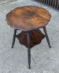 an old wooden table sitting on the ground