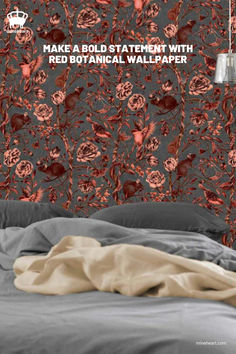 A cozy bedroom with a dark grey bedspread and light tan blanket, set against a vibrant wallpaper featuring red and brown floral and animal motifs. A metallic pendant light hangs on the side. Courtney Brims, Animals And Flowers, Artistic Space, Statement Wall, Botanical Design, Wallpaper Living Room, Nature Indoors