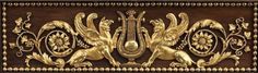 an intricately carved wooden panel with gold accents and lions on it's sides