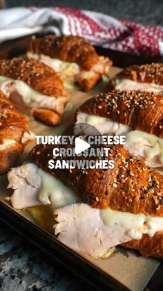 turkey cheese croissant sandwiches on a baking sheet with the words turkey cheese croissant sandwiches