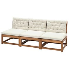 a wooden couch with white cushions on it's back and side ends, against a white background